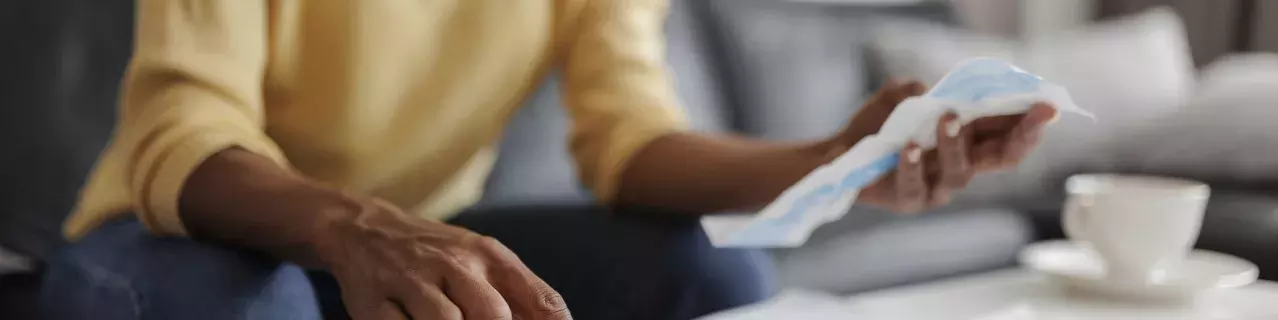 A person reviewing bills.