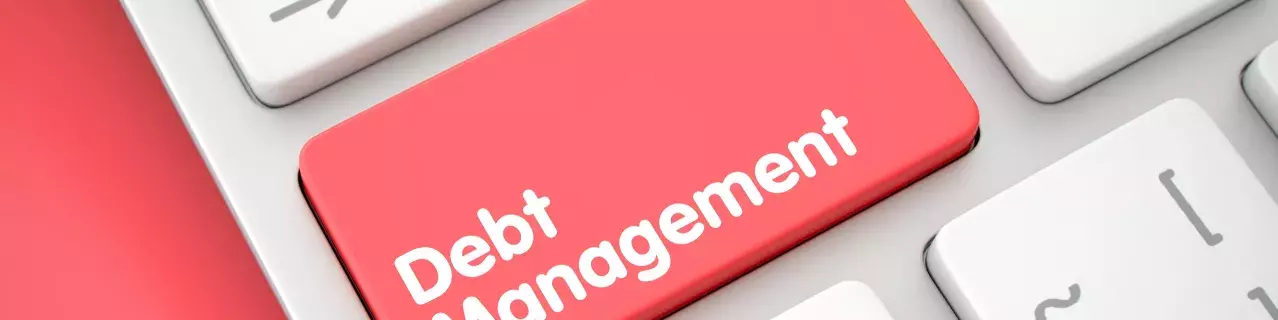 A keyboard with a "Debt Management" button.