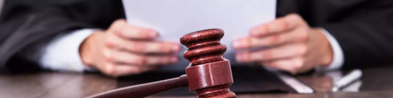 A judge reviewing court paperwork