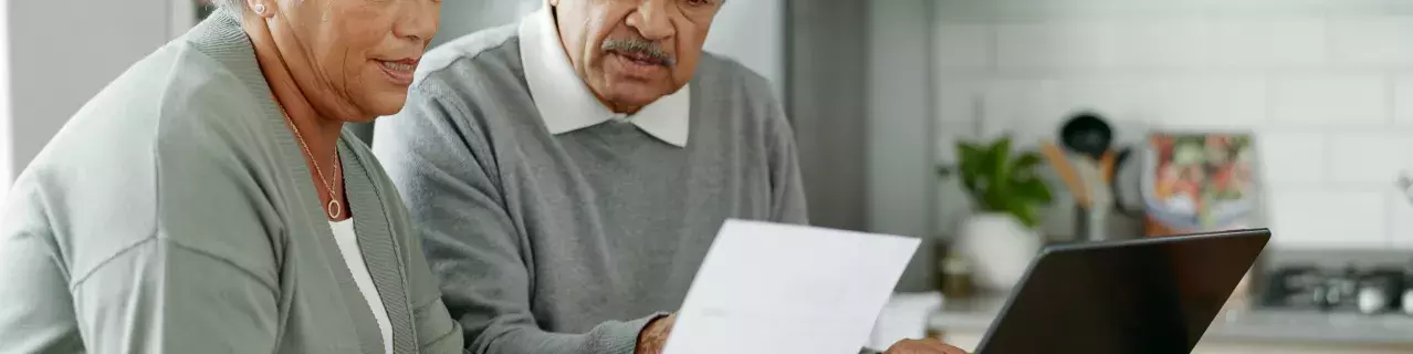 People looking at a letter inquisitively