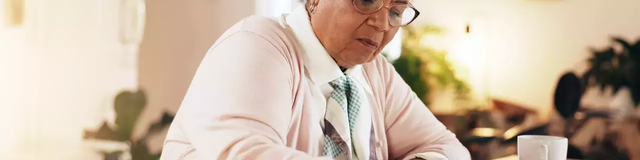 A person writing a letter