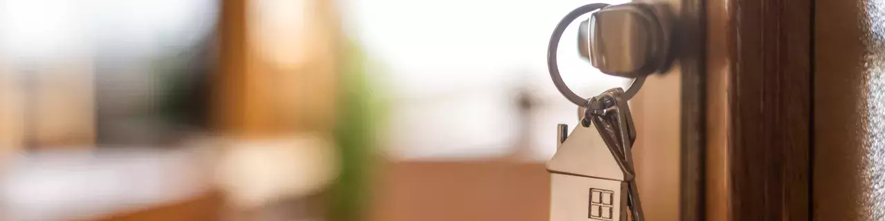 Photo of house keys in a door