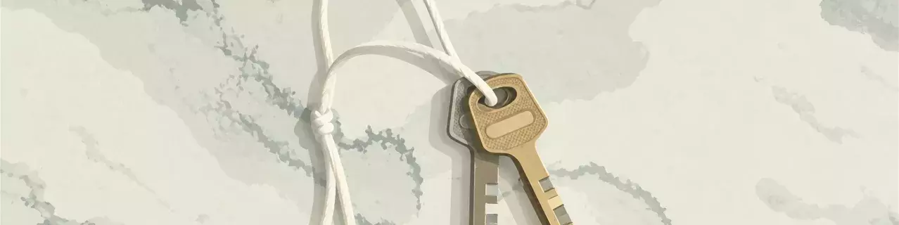 Pair of keys tied with string on marble