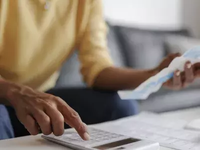 A person reviewing bills.