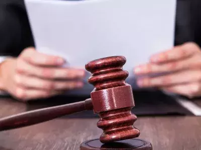 A judge reviewing court paperwork