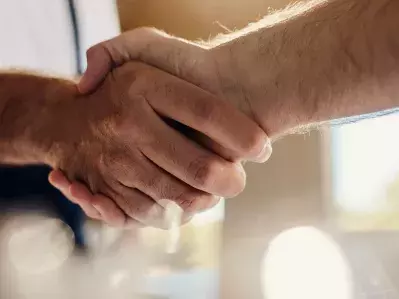 Two people shaking hands