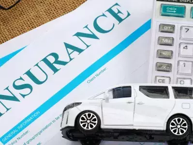 A picture of insurance paperwork on a desk