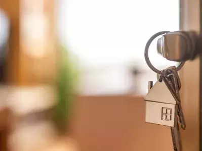 Photo of house keys in a door