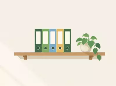 Row of file binders on office shelf