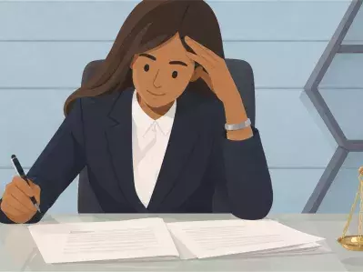 Lawyer reviewing legal documents at desk