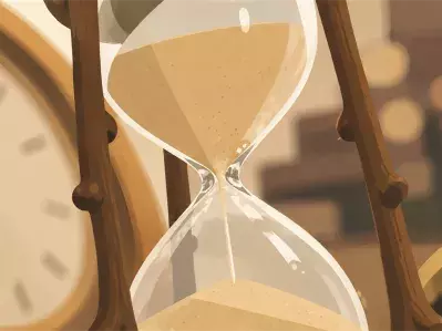 Hourglass and clock on desk