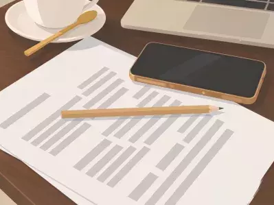 Agreement papers with laptop and coffee on table