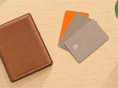 Leather wallet and credit cards on table