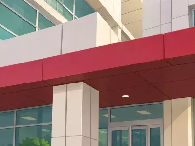 Modern hospital entrance with red canopy