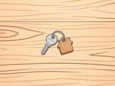 Keys and house keychain in open door lock