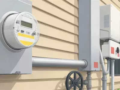Electric utility meter on house exterior
